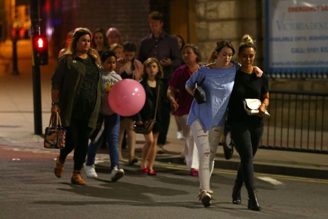 Ariana Grande Concertgoers leave Manchester Arena on May 22, 2017